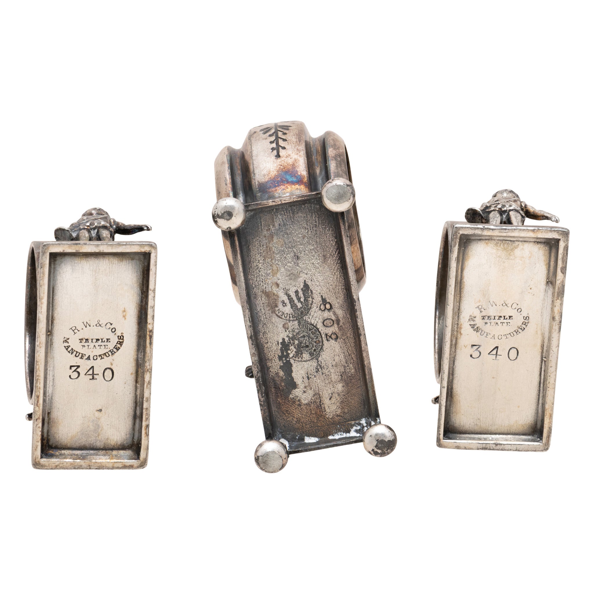 Three Victorian Silverplate Figural Napkin Rings